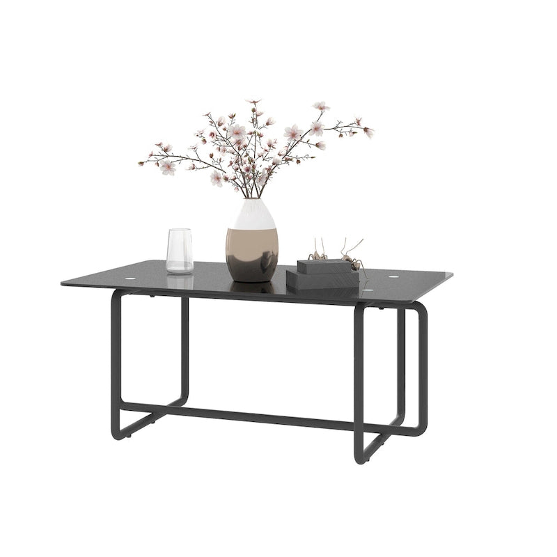 Moderner Couchtisch aus gehärtetem Glas und schwarzem Metall