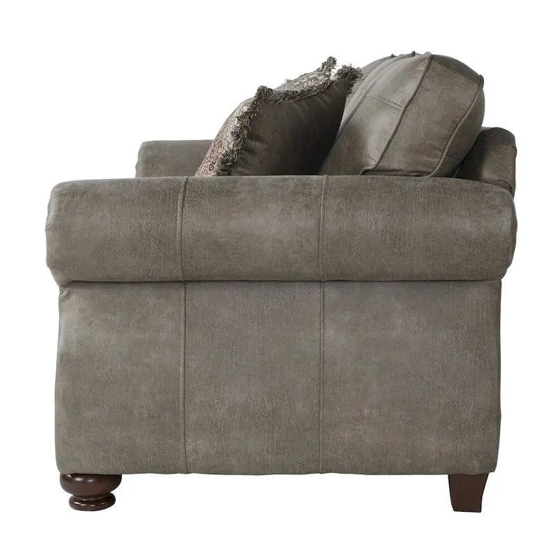 Sofá biplaza color gris piedra tapizado en cuero sintético con tachuelas decorativas