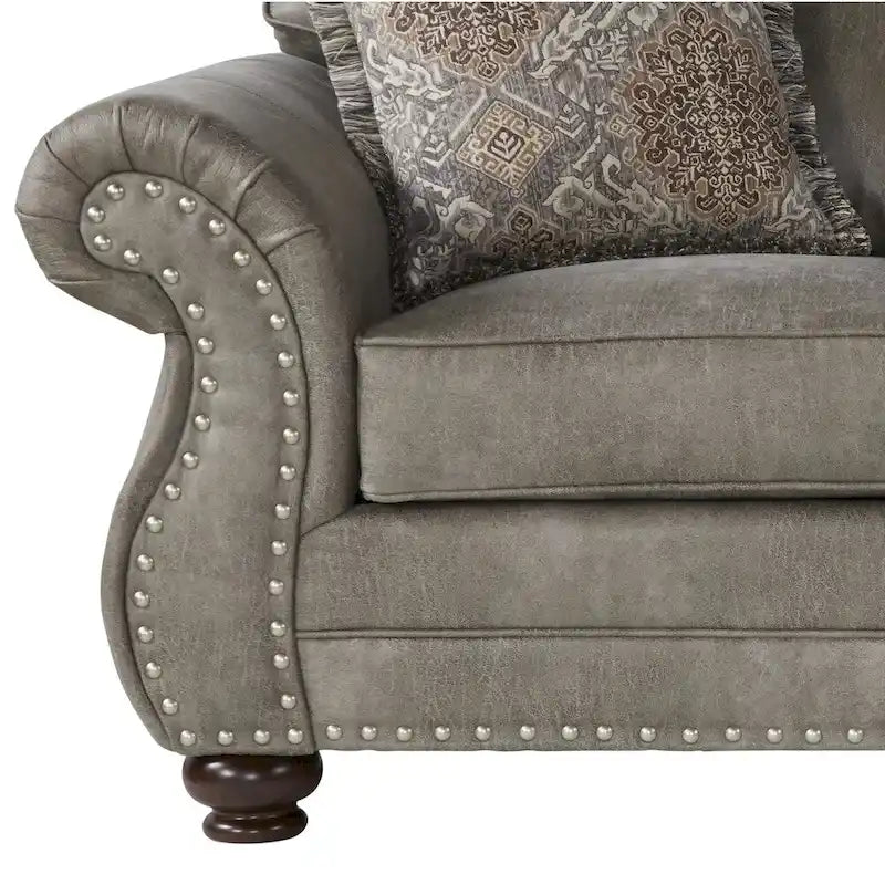 Sofá biplaza color gris piedra tapizado en cuero sintético con tachuelas decorativas